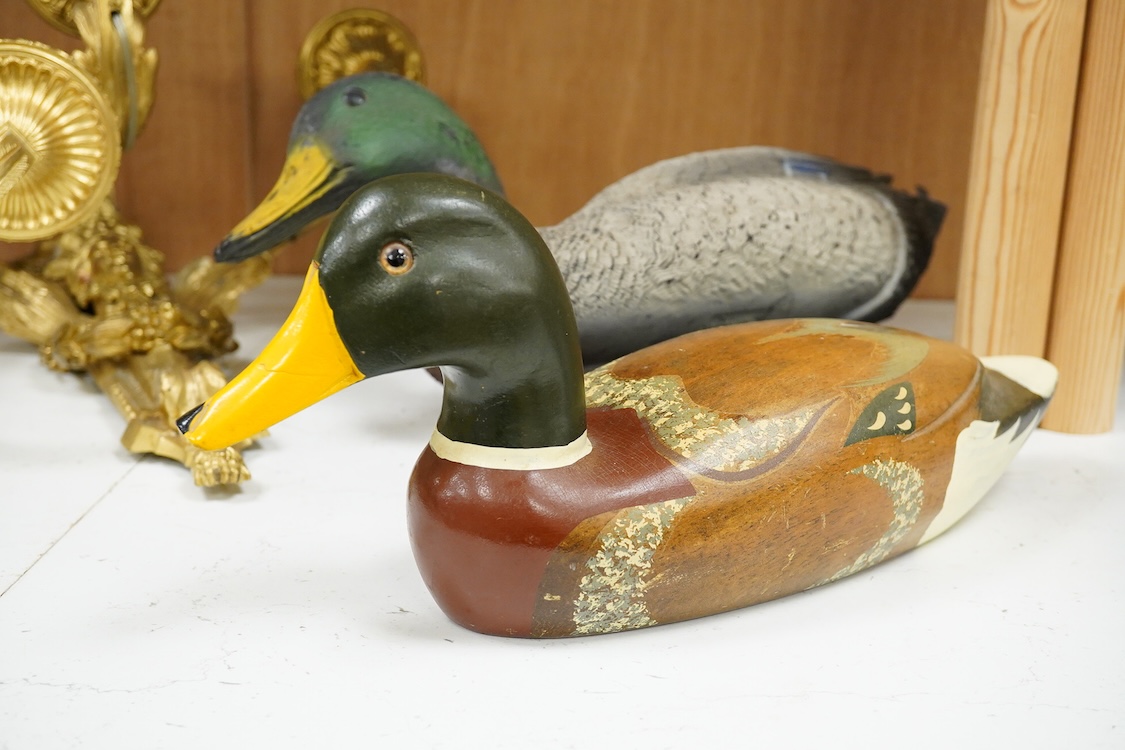 A decoy duck-42cm long, with a carved and painted wooden model of a duck. (2).